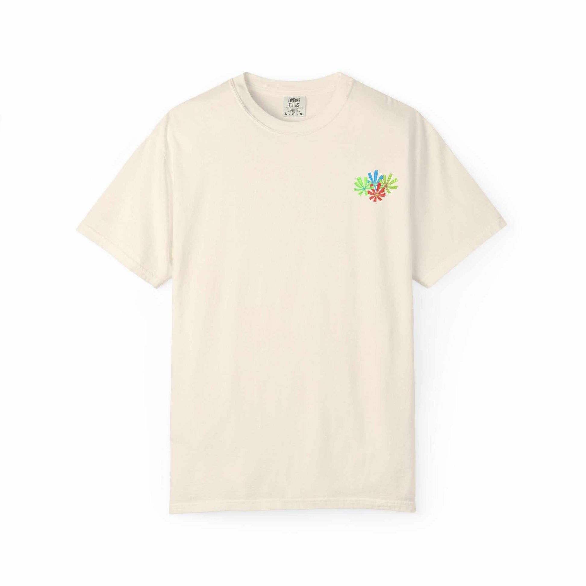 Island Tropical T-shirt in cream color with small colorful floral design on chest.