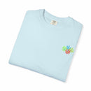 Island Tropical T-shirt with floral design on light blue fabric, showing unisex style.