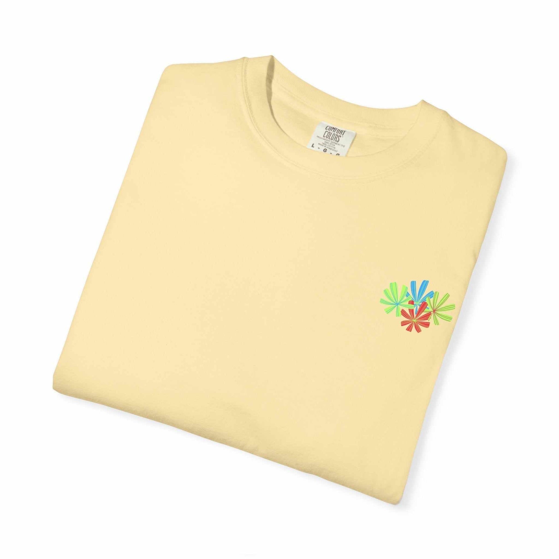 Island Tropical T-shirt folded with floral design, soft garment-dyed fabric.